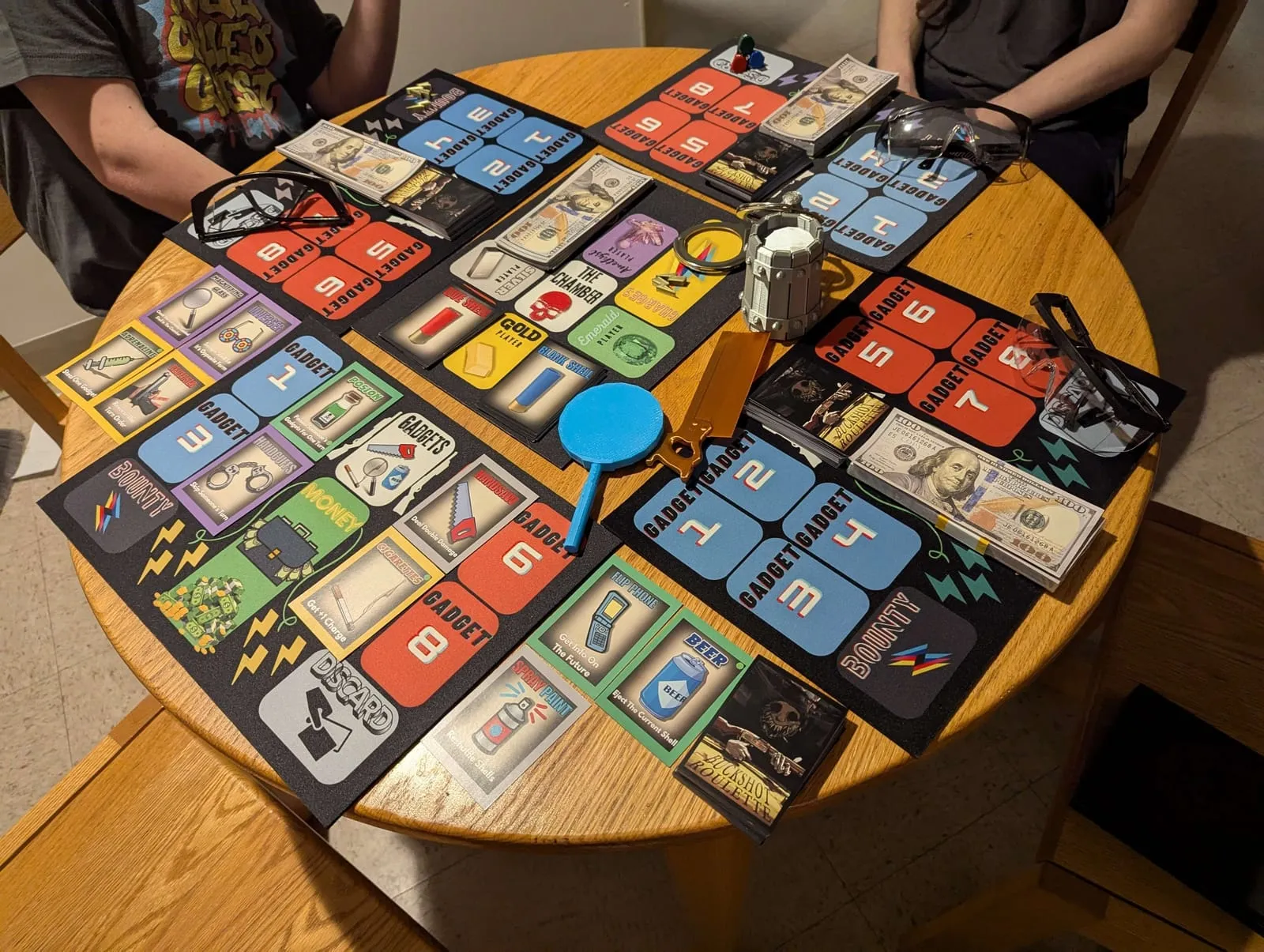 Buckshot Roulette — the full game laid out on a table mid-play